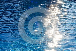 Water in swimming pool rippled water detail background