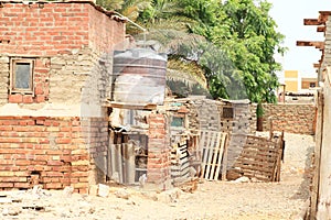 Water tank behind poor house in Marsa Alam