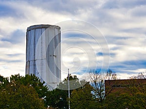 Water tank covered wile being painted