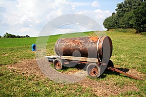 Water tank in a field