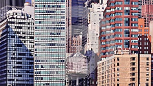 Water tank among modern buildings in Manhattan, NYC.