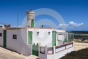 Water tank on rooftop of fishermenâ€™s hut.
