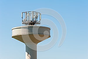 Water tank tower surmounted with a telephone repeater antennas