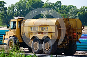 Water Tanker Word Truck at Construction Site