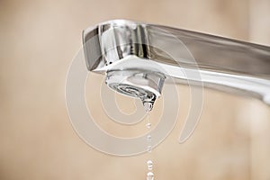 Water tap and drops of water. Water tap with dripping waterdrop. Water leaking, saving