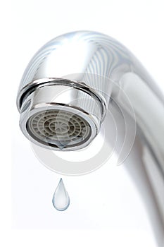Water tap with falling water drop on white
