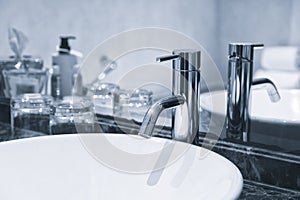 Water tap, faucet. Flow water in bathroom with sink.