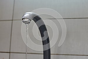 Water tap from a faucet.