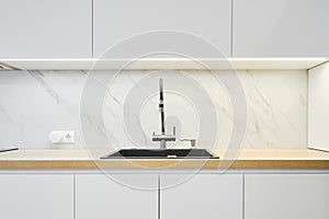 Water tap and sink in a modern kitchen