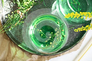 Water with tarragon grass refreshing antiparasitic freshness green tasty a light background photo