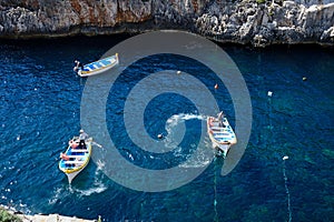 Water taxi boats in the bay, Glue Grotto.