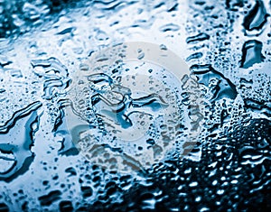 Water texture abstract background, aqua drops on blue glass as science macro element, rainy weather and nature surface art