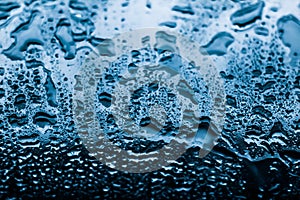 Water texture abstract background, aqua drops on blue glass as science macro element, rainy weather and nature surface art