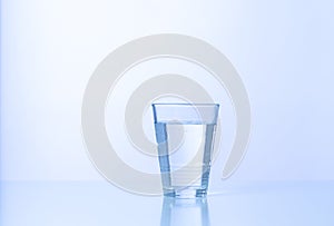 Water to drink a glass with coldness Ice on a table isolated photo