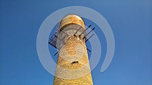 Water tower against the blue sky