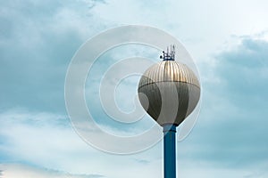 Water tower against overcast sky