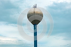 Water tower against overcast sky