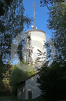 Water tower with antennae on its top