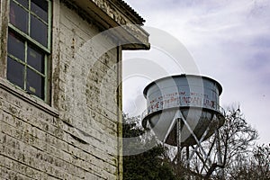 Water tower and barracks of the federal prison on Alcatraz Island of the United States in the bay of the city of San Francisco.