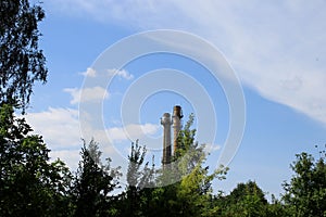 Water tower on blue sky background