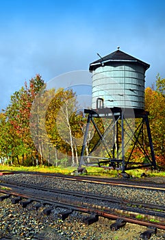 Water Tower next to Train Tracks