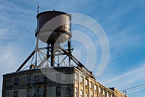 Water tower on roof of old building