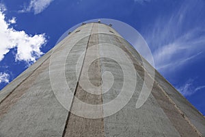 Water tower seen from the ground with summer sky