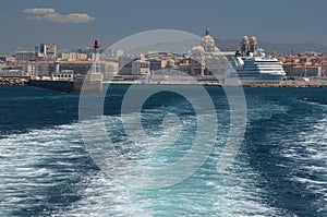 Water track leading to Marseille Cathedral and a cruise ship