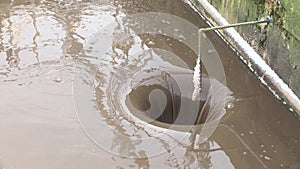 Water treatment facilities. Dirty water flows down into hole. silt precipitation