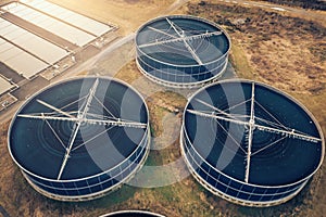 Water treatment plant aerial view from drone. Sewage and wastewater purification. Round tanks with sludge recycling