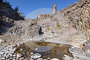 Water trickles into pool in desert