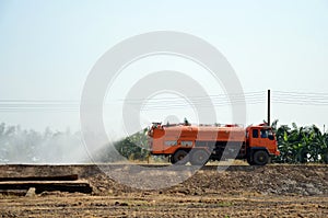 Water Truck spray to ground for protect occur dust