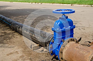 A water valve on a pipe that drains excess water. sewer cleaning photo