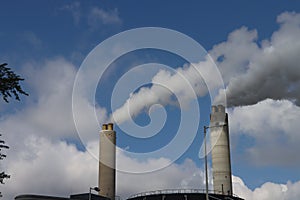 Water vapor comes from the chimneys of waste incinerator AEB in the West of Amsterdam photo