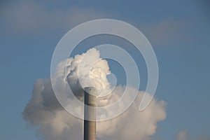 water vapor coming out of the chimney of the Hemcentrale, a coal power plant in Amsterdam of Vattenfall photo