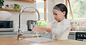 Water, washing hands and girl child in kitchen for hygiene, safety and responsibility in her home. Splash, cleaning and