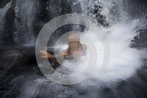 In the Water at a waterfall