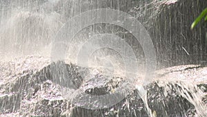 Water from a waterfall splashing over the rocks