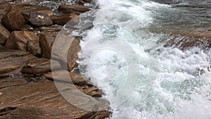 Water waves breaking themselves on rocks on the beach at Shelley Cove near Dunsborough in Yallingup National Park, WA