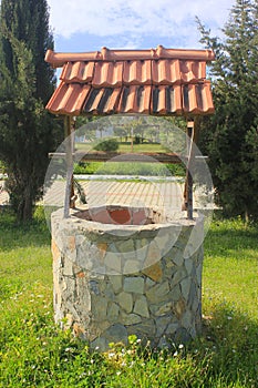 Water Well With Pulley and Bucket photo