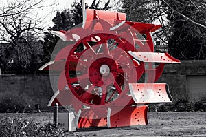 Water wheel of a paddle steamer in red