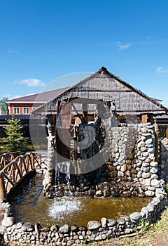 Water wheel and running water on a stone structure