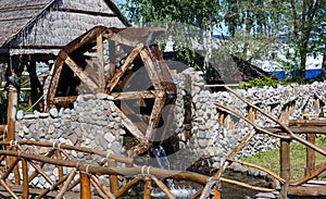 Water wheel and running water on a stone structure