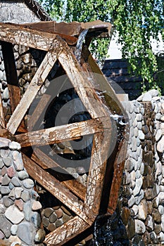 Water wheel and running water on a stone structure