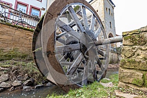 Water wheel in winter with icicles in Meisenheim