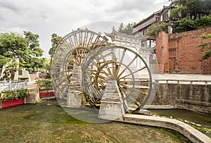 Water wheels in old town of Lijiang , Yunnan China.