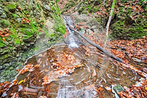 Water whirl in creek in Turovska roklina gorge during autumn in Kremnicke vrchy mountains