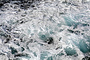 Water, white sea agitated bubbles, Tyrrhenian sea, background