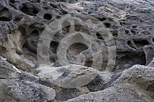 Water-worn Holes in Dark Sandstone Rock in Southern Utah