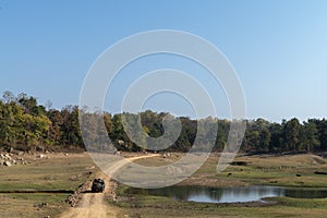 Waterbody and safari vehical landscape at Pench national Park,Madhya Pradesh